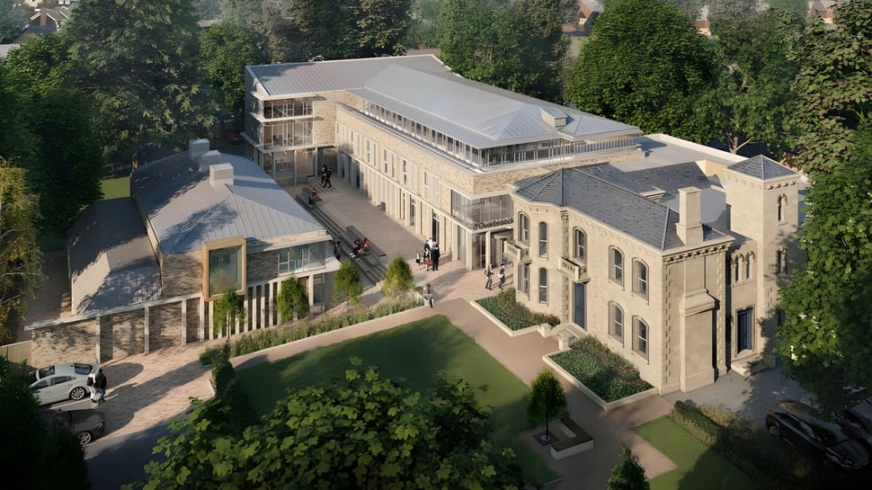 El gran edificio principal de D'Overbroeck's College está rodeado de árboles y áreas verdes.