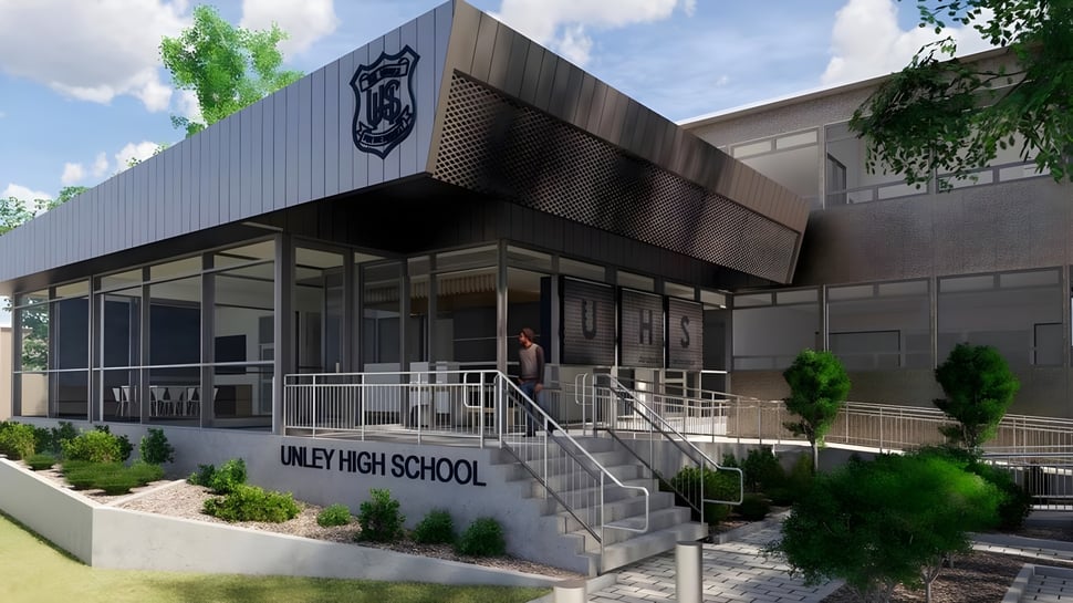 El moderno edificio escolar de varios pisos de la Unley High School está rodeado de un cuidado jardín exterior.
